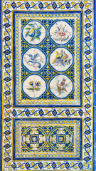 Obraz premium Colorful ceramic Azulejos tiles with flowers and birds in historical building in Portugal.