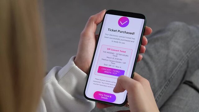 Woman checking her electronic event pass on a mobile app. High-quality footage showcasing mobile ticketing, online reservations, and the convenience of digital vouchers for entertainment and leisure.