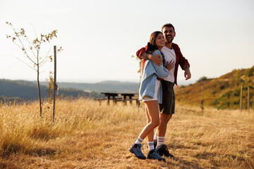 Fototapeta premium Couple hiking in nature on sunny summer day