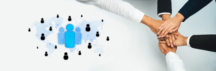 A powerful imagery featuring diverse hands joining together, symbolizing teamwork and unity across...