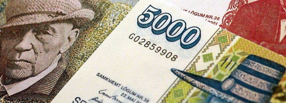 Icelandic krona money bills pile on table. Iceland banknotes of ISK currency close up. Concept of business, economy and banking in Iceland