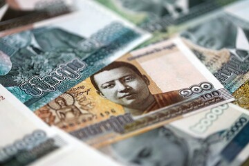 Cambodian riel money bills pile on table. Cambodia banknotes of KHR currency close up. Concept of business, economy and banking in Cambodia © mehaniq41