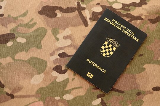 Croatian passport on table close up. Official identification document book for citizens of Croatia. Concept of travel and tourism in Croatia
