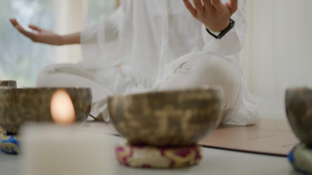 Tibetan singing bowl sound healing meditation candle relaxation focus yoga session for inner peace mindfulness ritual harmony gentle vibration calm hand mudra serene indoor studio