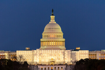Fototapeta premium The United States Capitol with scaffolding during the blue hour
