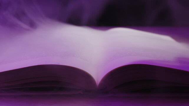 An open hardcover book rests on a surface enveloped in swirling purple smoke and thick fog. Concept of magic spells, fantasy storytelling, halloween mystery, and ancient knowledge.