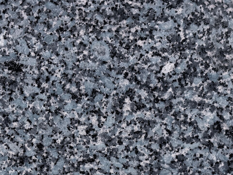 Close up of weathered dark blue granite stone texture. Suitable for wall covering and other graphic background. Seamless background texture.