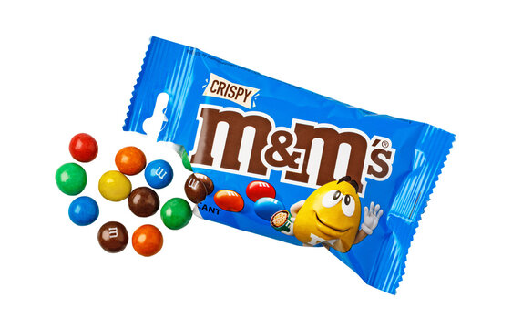 M&m's crispy chocolate candies spilling from blue wrapper