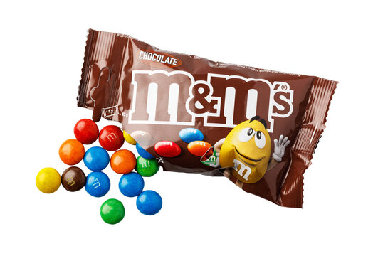 M&m's chocolate candies spilling from brown wrapper