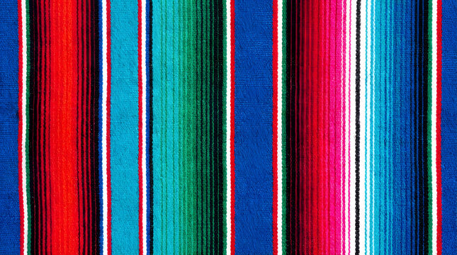 Vibrant colorful striped woven fabric. A beautiful Mexican serape textile with bold color vertical stripes.