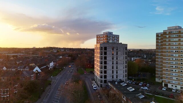An aerial clip of recent and older social housing apartment blocks in London, Britain. 