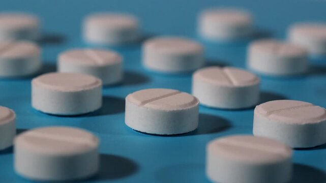 Medical pills. Round pills. Rotating platform. Slow motion video. High quality 4k footage