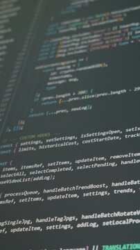 Vertical screen displays scrolling Javascript code with specific functions for AI processing and trend hunting. Concept of vibe coding, artificial intelligence software, and modern app development