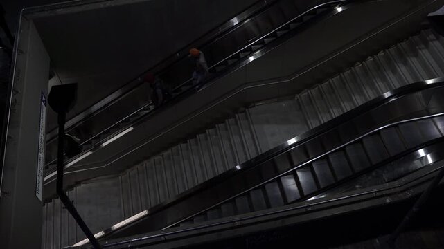 Night cityscape escalators with people 