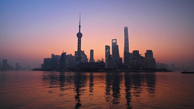 Shanghai skyline with Oriental Pearl Tower and Lujiazui financial district during sunrise and sunset, China. February 15, 2026