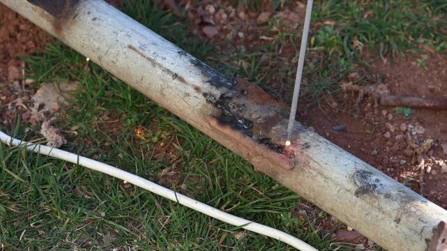 Welding process with bright sparks and smoke