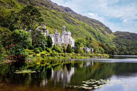 Kylemore Abbey with water reflections in Connemara, County Galway, Ireland, Europe. Benedictine monastery founded 1920 on the grounds of Kylemore Castle. Mainistir na Coille Moire
