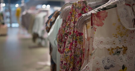 clothes are hanging on hangers in the store, there are no people in the store, shopping, have fun...