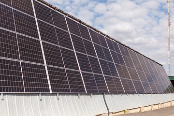 Fototapeta premium solar panels on sky background. Renewable sunlight energy, eco-friendly electricity concept