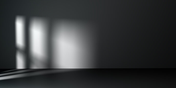 Dark minimalist empty room with black wall and floor featuring soft window light shadow. Blurred luxury interior background for premium product showcase, cosmetic mockup, and studio display.