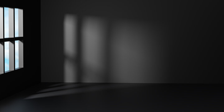 Dark empty room interior with black walls and floor featuring soft window light and shadow. Minimalist luxury studio background for premium product display and architectural mockup.