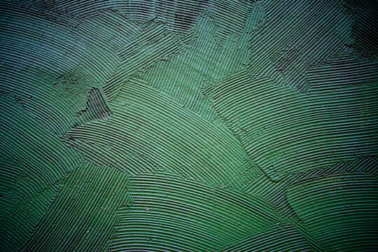 Tynk strukturalny koloru zielonego na ścianie budynku, Green textured plaster on the building wall