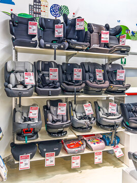 Italy - March 6, 2026: variety of child safety car seat  compliant with the latest i-Size standard (ECE R129) for use from birth up to age 12 (40&ndash;150 cm), display in baby goods store