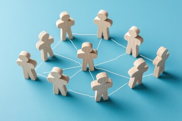 Obraz premium Unity and Connection: Wooden figures symbolize a connected network, emphasizing collaboration and the strength found in togetherness.