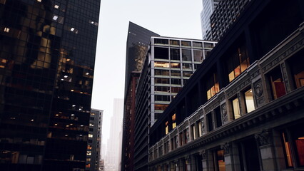 historic facade beside mirrored tower at dawn, ornate cornices and illuminated retail windows line misty alleyway, reflective curtain wall glass scatters soft © icetray