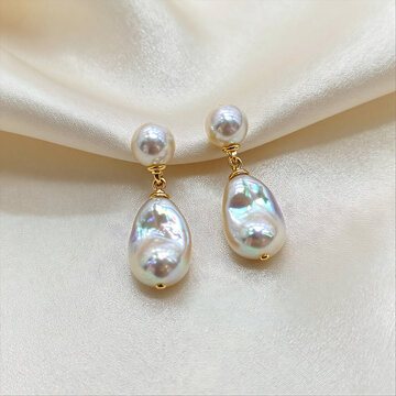 Elegant Keshi Pearl Earrings on Ivory Silk Background