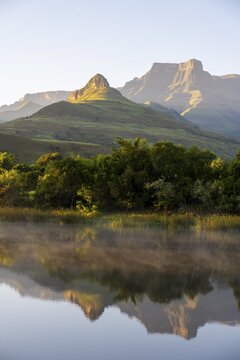 Sunrise, amphitheatre with reflection in the lake, Royal Natal National Park, Drakensberg Mountains south, Kwa Zulu Natal, South Africa