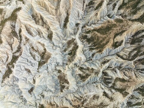 Bare ridges of eroded sandstone in the badlands of the Tabernas Desert, Europe's only true desert, aerial view, drone shot, Almer&iacute;a province, Andalusia, Spain