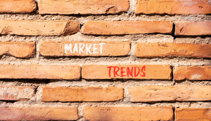 Fototapeta premium Market trends words symbol. Concept words Market trends on beautiful brick wall. Beautiful brick wall background. Business and Market trends words concept. Copy space.