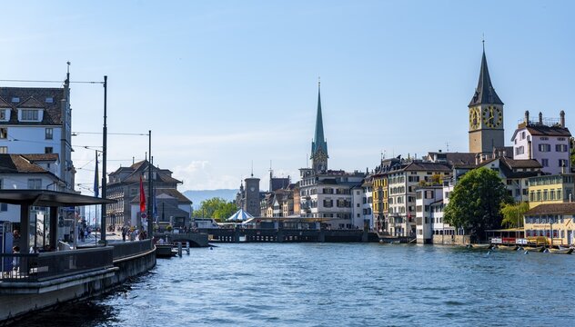 Fraum&uuml;nster and church tower St. Peter, panorama with Limmat in the old town of Zurich, Switzerland