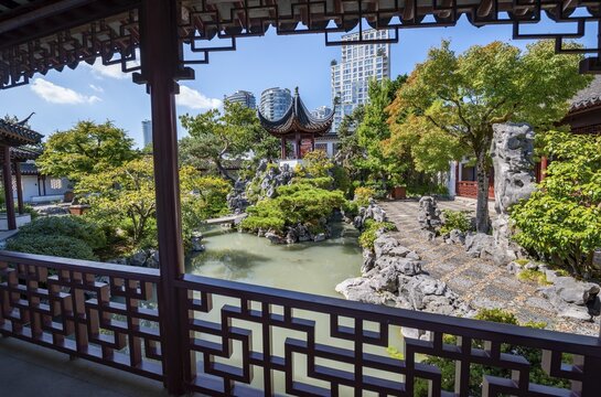 Traditional Chinese Pagoda in Dr. Sun Yat-Sen Classical Chinese Garden, in front of skyscrapers, Vancouver, British Columbia, Canada