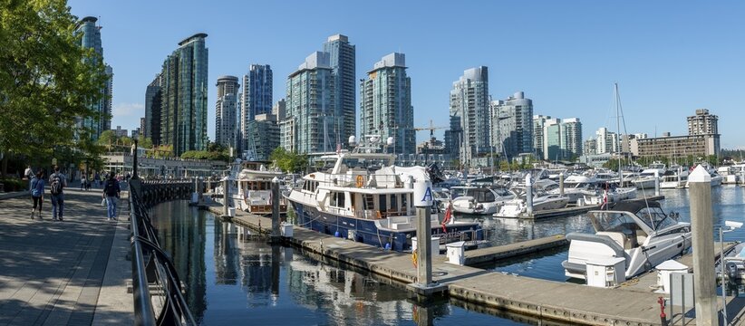 Boats in the marina, high-rise buildings on the promenade, Coal Harbour, Vancouver, British Columbia, Canada