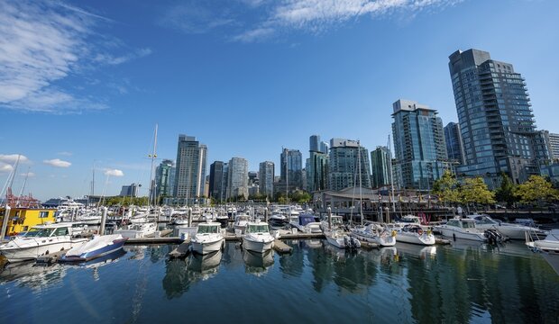 Sailboats in the marina, high-rise buildings on the promenade, Coal Harbour, Vancouver, British Columbia, Canada