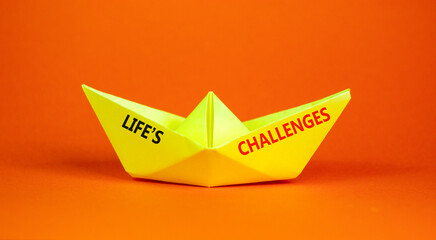 Life's challenges words symbol. Concept words Life's challenges on beautiful yellow paper boat. Beautiful orange background. Business lifestyle and Life's challenges words concept. Copy space.