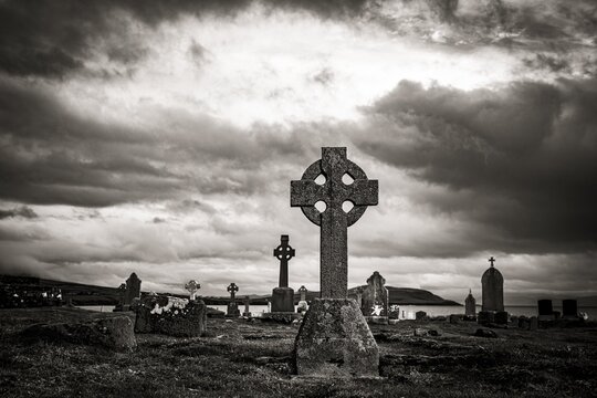 Black and white, Creepy old grave crosses with cloudy sky, Dingle Peninsula, Kerry, Ireland