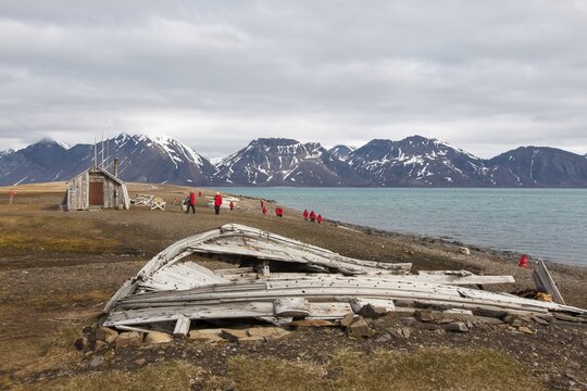 Former whaling station Bamsebu in Bellsund, dilapidated wooden boat, Spitsbergen, Norway