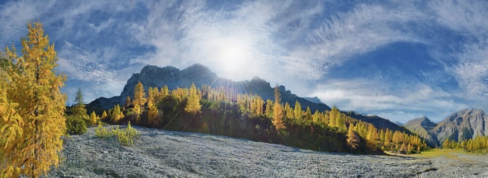 Glowing autumnal mountain forest below the Lamsenjoch massif with bizarre cloudy sky, Binsalm, Engtal, Karwendel, Pertisau, Hinterri&szlig;, Tyrol, Austria
