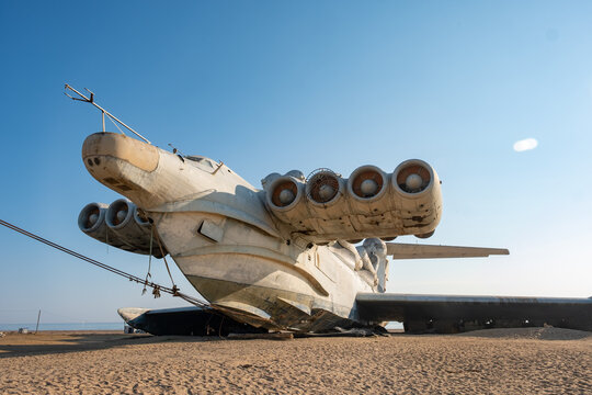 Lun Ekranoplan Lies on the Sand at a Former Military Testing Site in a Coastal Area During Clear Weather