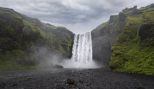 Sk&oacute;gafoss waterfall in dramatic mood, South Iceland, Iceland