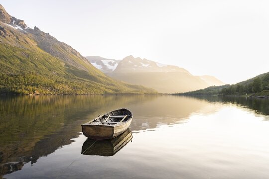 Rowing boat in the backlight, Innerdalsvatna lake, Innerdalen high valley, Trollheimen Mountain Area, Sunndal, M&oslash;re og Romsdal, Vestland, Norway
