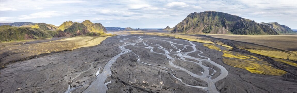 River with fanned out branches through black lava sand, mountains Sk&aacute;larfjall and Remundargilsh&ouml;fud, Icelandic highlands, panorama, aerial view, river M&uacute;lakv&iacute;sl, &THORN;akgil, Iceland