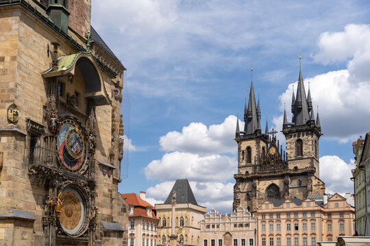 Astronomical clock on the facade of the Old Town Hall against the backdrop of Tyn Church in Prague&rsquo;s Old Town
