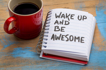 wake up and be awesome - motivational advice in a sketchbook with a cup of coffee