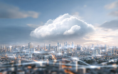 Fototapeta premium A futuristic cityscape with interconnected digital networks under a bright cloud, symbolizing cloud computing and smart technology integration.