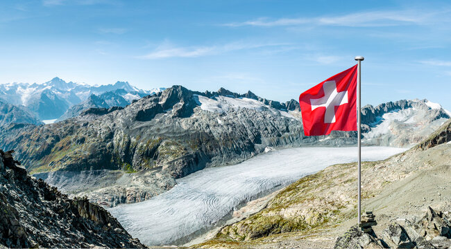 Swiss mountain panorama at the Rhone Glacier with Swiss national flag