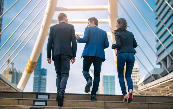 Portrait of business team climbing stairs go to a city. Business concept.